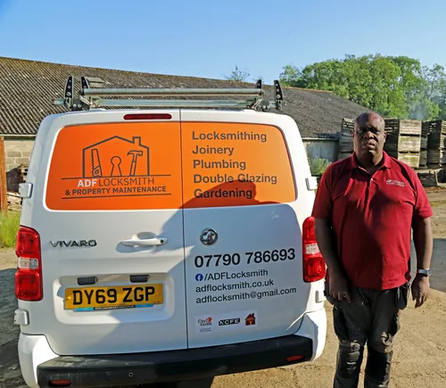 Andrew Fisher standing next to rear of ADF Locksmith maintenance van